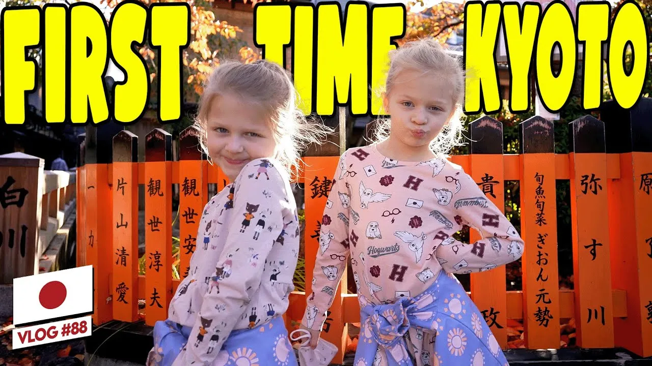 YouTube thumbnail for the Clarkson family's first time in Kyoto vlog, featuring a scene from their visit to Kani Doraku crab restaurant.