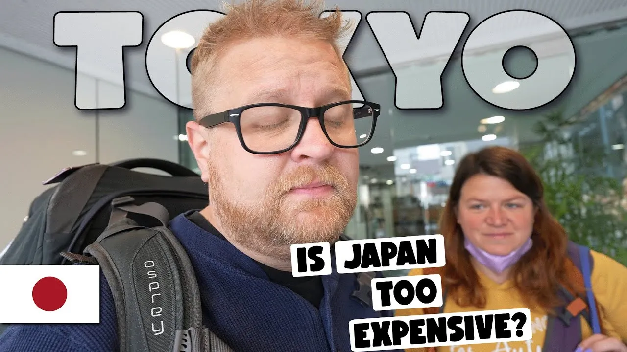 A YouTube thumbnail of Adam and Lindsay with backpacks on moving day in Tokyo, asking whether Japan is too expensive.